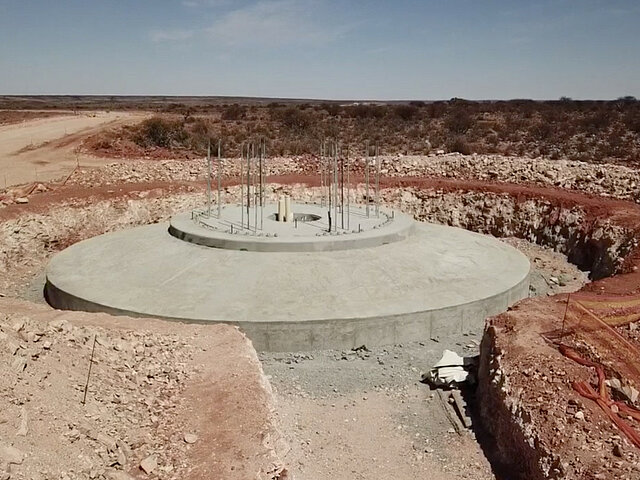 The concrete-cast foundation of a wind energy plant at the Garob wind farm. The excavation for the cable trench is also already in place